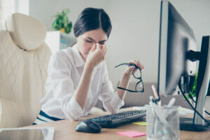 woman rubbing eyeballs
